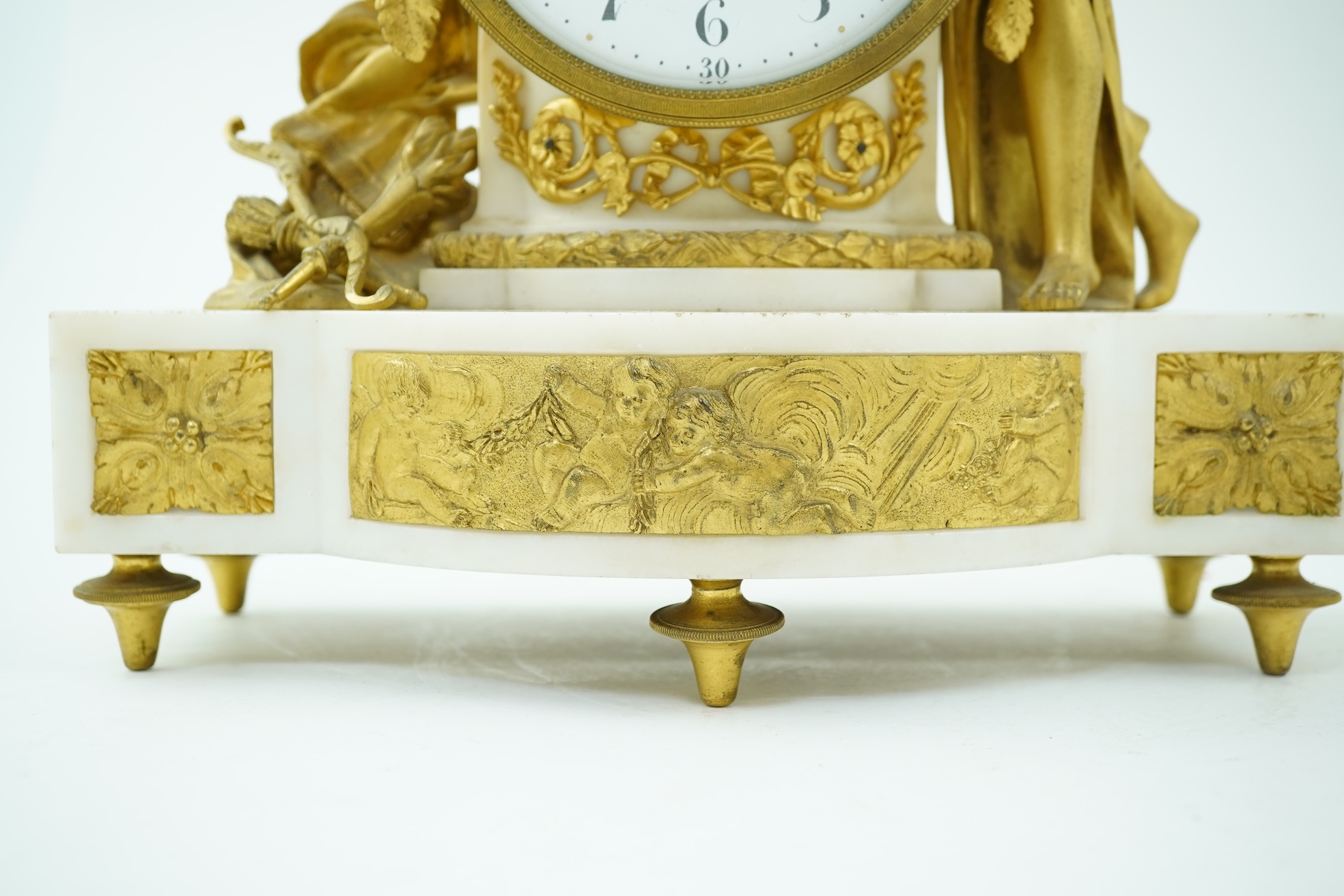 An early 19th century French figural ormolu and white marble mantel clock